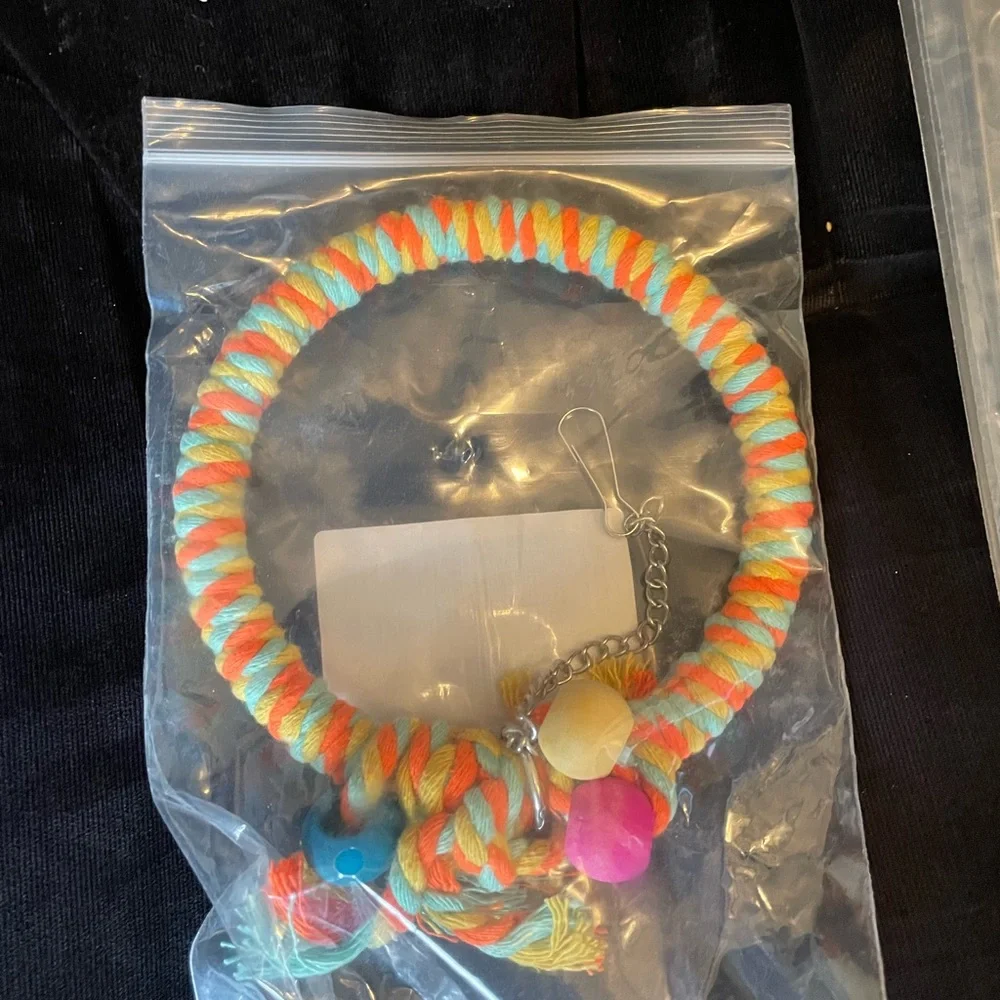 Colorful rope perch and fruit skewers